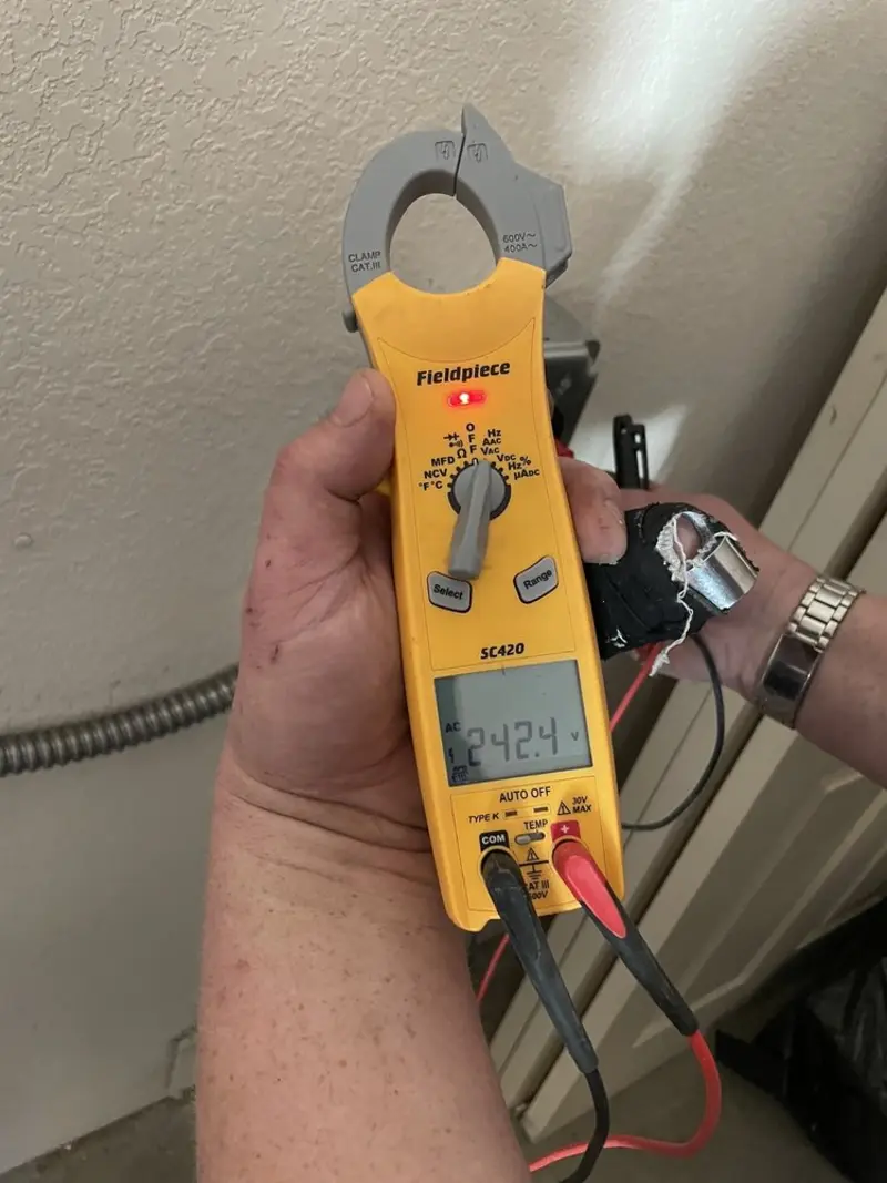 Voltage testing with clamp meter during Electrical Installation Services in Marcy